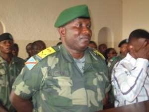Democratic Republic of Congo's lieutenant-colonel Bedi Mobuli Engangela appears in court during his trial on December 15, 2014, in Bukavu.  By Jean Baptiste Baderha AFP