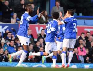 Everton's Lacina Traore L celebrates after scoring the opening goal of the English FA Cup fifth round football match between Everton and Swansea City at Goodison Park in Liverpool, northwest England on February 16, 2014.  By Andrew Yates AFP