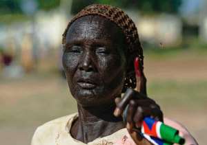 A woman holds up her finger after voting in a referendum in Abyei on the border of Sudan and South Sudan on October 28, 2013.  By Ali Ngethi AFP