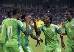Nigeria's players celebrate a goal during the 2015 Africa Cup of Nations qualifier against Sudan in Abuja on October 15, 2014.  By Pius Utomi Ekpei AFP