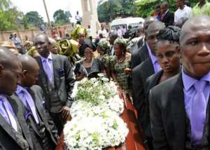Mourners carry Chinua Achebes coffin to St. Philips Anglican Church at Ogidi, southeast Nigeria, on May 23, 2013. By Pius Utomi Ekpei (AFP)