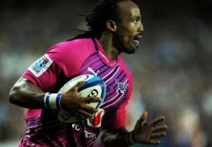 Akona Ndungane from South Africas Northern Bulls breaks clear to score a try in Sydney on May 11, 2012. By Greg Wood (AFP/File)