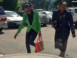 Disgraced Kenyan marathoner Rita Jeptoo left arrives on January 15, 2015 at the Athletics Kenya headquarters in Nairobi with her lawyer in Nairobi for a hearing.  By Tony Karumba AFP