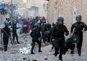 Algerian security forces clash with residents of Ghardaia following sectarian violence on March 18, 2014.  By Farouk Batiche AFPFile