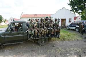 M23 rebels sit on the back of a truck on June 1, 2013 in Rumangabo military camp, 40 km from Goma.  By Junior D. Kannah (AFP)