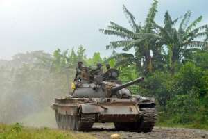 A DR Congo FARDC government tank patrols outside Bunagana in eastern Democratic Republic of Congo close to the Uganda border on October 31, 2013.  By Junior D. Kannah (AFP/File)