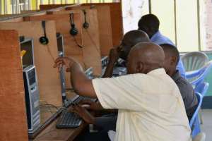 Local residents use computers at an internet cafe in Kinshasa on February 4, 2015. By PAPY MULONGO (AFP)