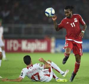 Tunisia's defender Hamza Mathloudi L challenges Equatorial Guinea's midfielder Javier Balboa during their 2015 African Cup of Nations quarter-final football match  in Bata on January 31, 2015.  By Carl De Souza AFP