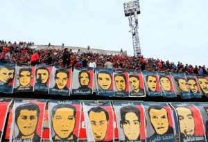 Portraits of the victims of the Port Said Stadium riot are seen during an Al-Ahly football match in Mokhtar El-Tetsh Stadium in Cairo on February 1, 2014, to mark the second anniversary of the deadly event.  By Mohamed el-Shahed AFPFile