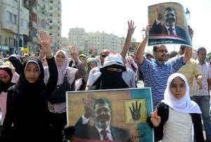 Supporters of Mohamed Morsi demonstrate against the military on September 20, 2013 along the seafront in the northern coastal city of Alexandria.  By  AFPFile