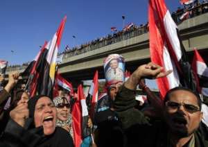 Supporters of the Egyptian military carry a picture of Field Marsal Tantawi at a rally in Cairo.  By Mohammed Abed (AFP/File)