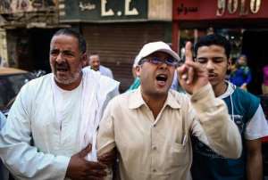 Egyptians pictured outside a courtroom in the southern province of Minya on June 21, 2014 after the court confirmed death sentences for 183 Islamists, including Muslim Brotherhood leader Mohamed Badie.  By Mohamed Elshahed AFPFile