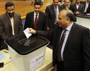 Egypt's Islamist Parliament Speaker Saad al-Katatni casts his vote to chose a panel that will draft the constitution.  By  AFPFile