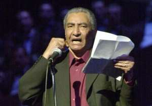 Egyptian poet Abdel Rahman al-Abnudi reading a poem at the Cairo Opera House, on May 2, 2002.  By Khaled Desouki AFPFile