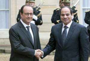 French President Francois Hollande left greets his Egyptian counterpart Abdel Fattah al-Sisi upon his arrival at the Elysee Palace in Paris, on November 26, 2014.  By Alain Jocard AFP