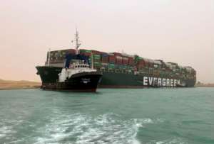 Egypt's Suez Canal Authority said it was working to refloat the MV Ever Given.  By - Suez CANALAFP