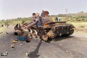 Eritrean children play on a wrecked Ethopian tank in Asmara on June 7, 1991.  By Alexander Joe AFPFile