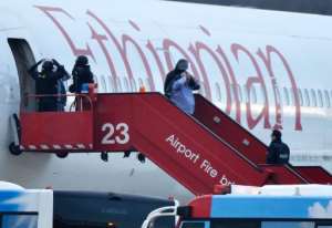 Police evacuate passengers on February 17, 2014 from an Ethiopian Airlines flight en route to Rome which was hijacked and forced to land in Geneva.  By Richard Juilliart AFP