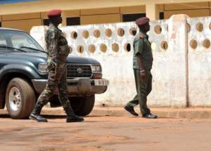 Soldiers stand guard in front of the Army Sporting Club building where a meeting is being held in Bissau. By Seyllou (AFP)
