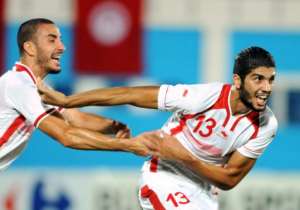Tunisia's Ferjani Sassi R celebrates with teammate Stephane Houcine Nater  after scoring during the Africa Cup of Nations qualifying match against Senegal in Monastir on October 15, 2014.  By Salah Habibi AFP