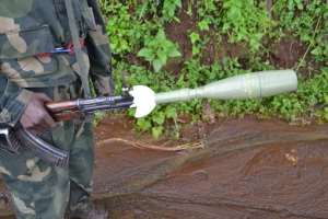 A Democratic Republic of Congo soldier holds a self-propelled rocket in the eastern North Kivu region on November 5, 2013.  By Habibou Bangre AFPFile