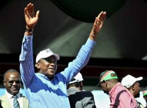 Uhuru Kenyatta waves to supporters in 2011. By Tony Karumba (AFP/File)