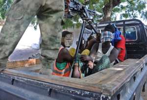 Four suspected Shebab fighters are detained by Somalian national soldiers following a gun battle in Mogadishu that left four other suspects dead on December 26, 2014.  By Mohamed Abdiwahab AFP