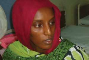 Meriam Yahia Ibrahim Ishag sits in her cell at a women's prison in Omdurman, on May 28, 2014 after giving birth to a baby girl.  By  AFPFile
