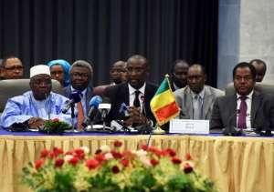 Malian Foreign Minister Abdoulaye Diop C chairs a meeting on peace talks attended by Mali's various warring factions, on July 16, 2014 in the Algerian capital Algiers.  By Farouk Batiche AFPFile
