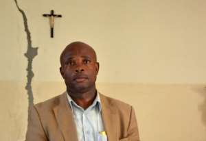 Emmanuel Mba Bekale speaks about the unexplained death of his daughter, in Libreville, on October 26, 2012.  By Patrick Fort AFPFile