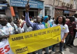 Protesters gather outside the Gambian embassy in Senegal to protest against the execution of nine prisoners.  By Seyllou (AFP)