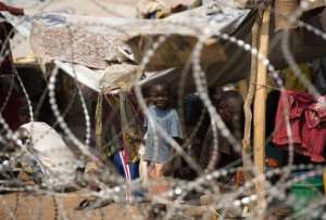 A child is pictured in a camp for internally displaced persons IDP close to the airport in Bangui on January 1, 2014.  By Miguel Medina AFP