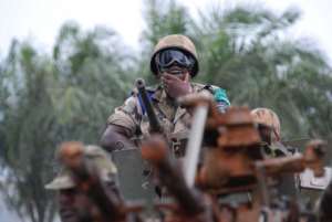 A member of the Multinational Force of Central Africa FOMAC patrols on July 20, 2013 in Bangui.  By Xavier Bourgois AFPFile