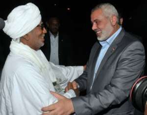 Haniya, right, was greeted at the airport by an adviser to President Omar al-Bashir.  By Ebrahim Hamid AFP