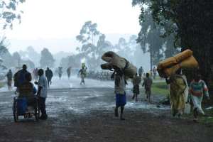 Congolese refugees returning from Uganda walk back home on November 1, 2013, in Bunagana, 99 kms from the eastern Democratic Republic of Congo city of Goma, at the frontier with Uganda.  By Junior D. Kannah AFPFile