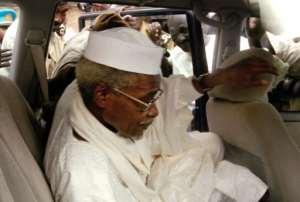 Chad's ex-dictator Hissene Habre leaves Dakar's courthouse escorted by prison guards, November 25, 2005.  By  AFPFile