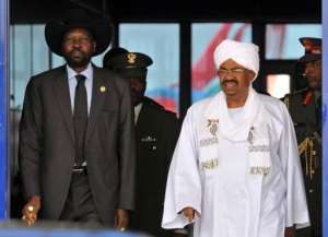 Omar al-Bashir R greets Salva Kiir upon the latter's arrival in Khartoum, in 2011.  By Ebrahim Hamid AFPFile