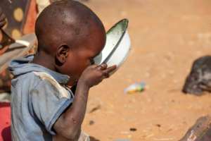 A child drinks water at Zam Zam camp for Internally Displaced People near El Fasher in Darfur, Sudan, on February 18, 2015, in this photo released by the United Nations-African Union Mission in Darfur UNAMID.  By Hamid Abdulsalam UNAMIDAFPFile