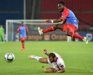 Democratic Republic of Congo forward Cedrick Mabwati R jumps over Tunisia's midfielder Yassine Chikhaoui during the 2015 African Cup of Nations group B football match in Bata on January 26, 2015.  By Carl de Souza AFP