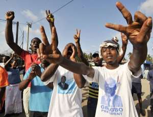 Supporters of the Ivorian Popular Front cheer during a rally in support of Laurent Gbagbo in Abidjan, on October 30.  By Sia Kambou (AFP/File)