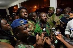 Issiaka Ouattara C, spokesperson of the mutinous soldiers who took over Ivory Coast's second city of Bouake, speaks to journalists after negotiations with the defence minister unseen on January 7, 2017 in Bouake.  By Sia KAMBOU AFP