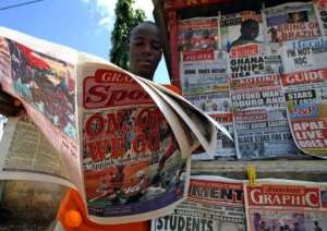 A man reads a newspaper on June 23, 2006 in Accra.  By Kambou Sia AFPFile