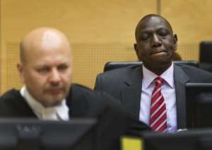 William Ruto right sits in the courtroom before their trial at the ICC in The Hague on September 10, 2013..  By Michael Kooren PoolAFPFile