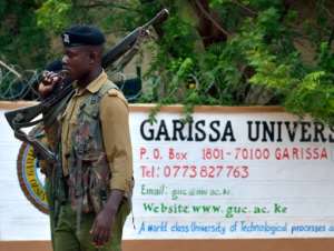 A security officer stands guard at the entrance of Garissa university college in January 2016 after it reopened following a deadly siege by four gunmen, nine months previously.  By Tony Karumba AFPFile
