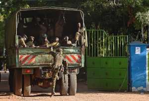 Kenya soldiers enter the Moi University campus of the northeastern town of Garissa on April 3, a day after Shebab militants killed almost 150 students.  By Carl De Souza AFP