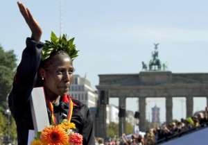 Florence Kiplagat of Kenya celebrates after the 38th Berlin Marathon on September 25, 2011 in Berlin.  By Odd Andersen AFPFile