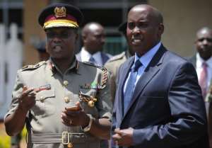 File photo taken on April 9, 2014 shows Kenyas Interior Minister Joseph Ole Lenku (R) and Commissioner of Police, David Kimaiyo, at a vetting centre in the Somali district of Eastleigh in the Kenyan capital, Nairobi. By Tony Karumba (AFP/File)