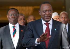 Uhuru Kenyatta (right) in London on May 7, 2013.  By Andrew Cowie (AFP/File)