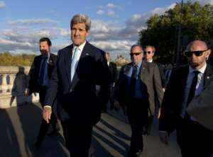 US Secretary of State John Kerry walks in Paris on October 13, 2014.  By Carolyn Kaster PoolAFP