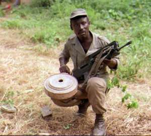 A Senegalese soldier displays a piece of a landmine November 1, 1997, in the southern Casamance region.  By  AFPFile